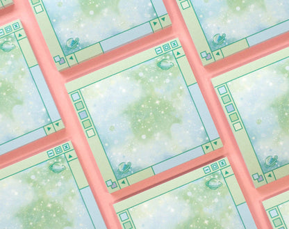 A close-up of a repeating patterned surface featuring pale green and white speckled panels framed by coral pink borders, with small decorative motifs in the corners.