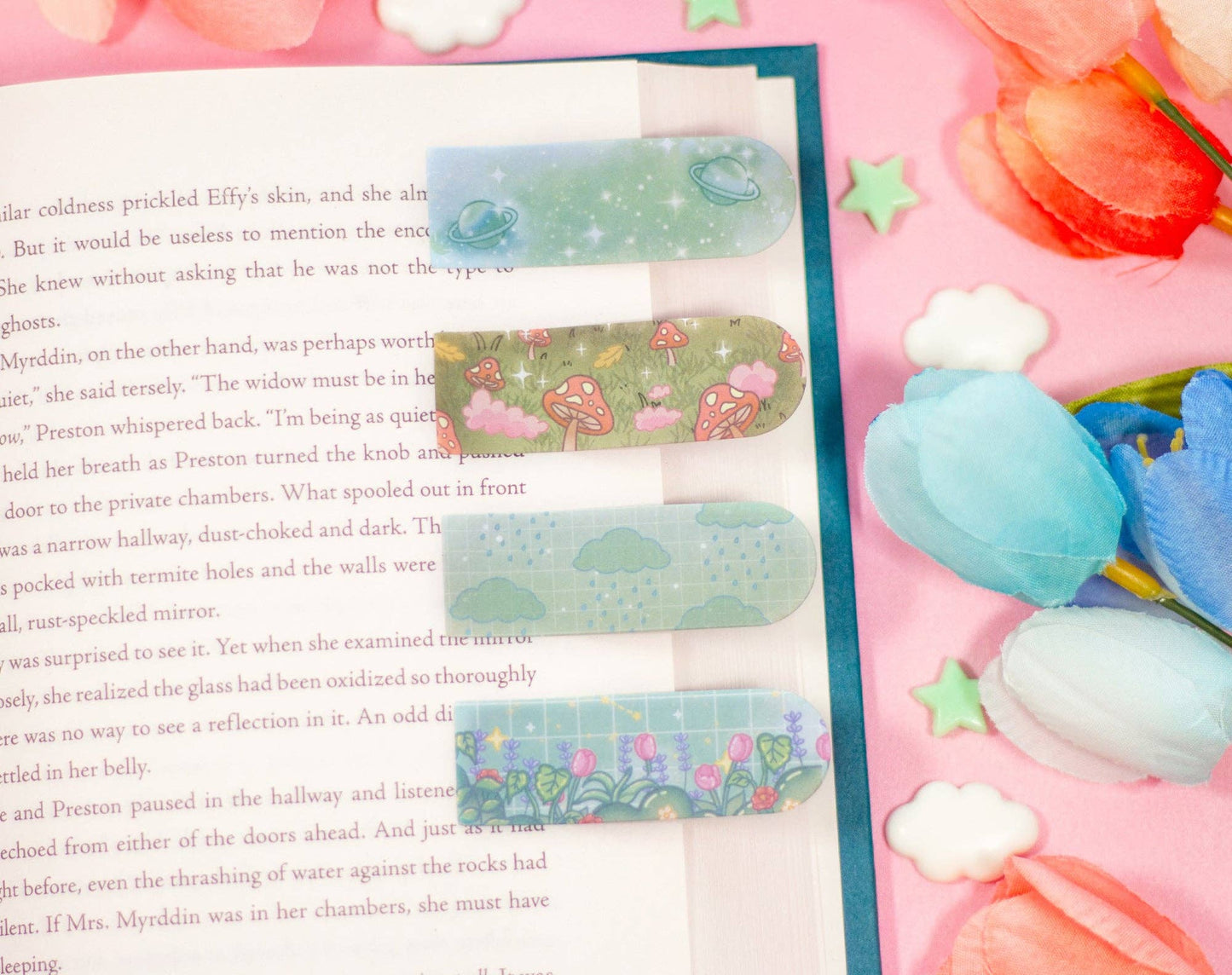 Decorative bookmarks with colorful designs on a book page.