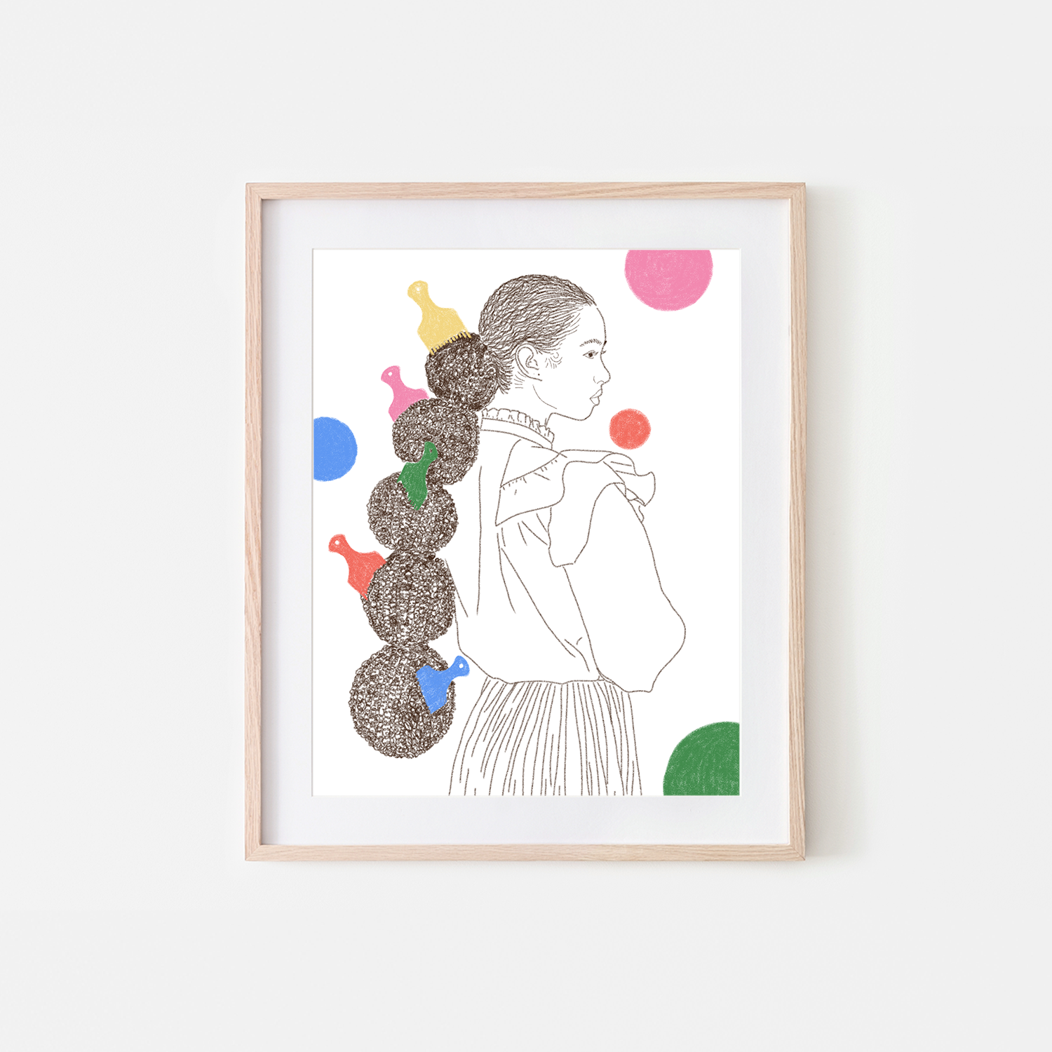 Framed artwork of a woman with colorful buns on a white background