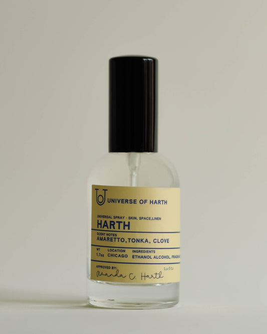 Harth: Room, Space and Body Spray, Bottle of 'Universe of Earth' HARTH with a black cap on a beige background
