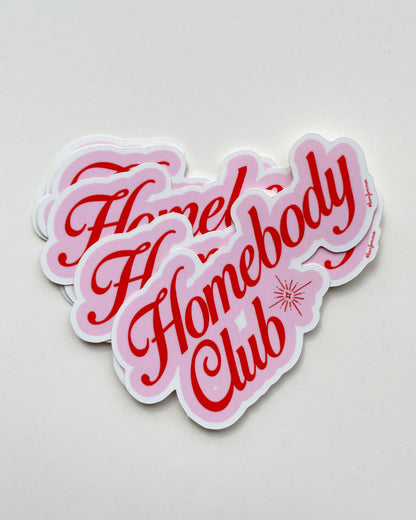 Sticker with 'Homebody Club' text in pink and red on a light gray background, Homebody Club Sticker Bon Femmes