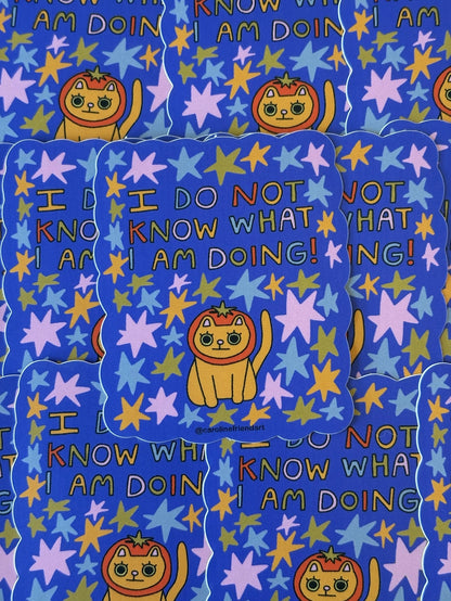 Patterned fabric with cartoon cat, stars, and text on a blue background