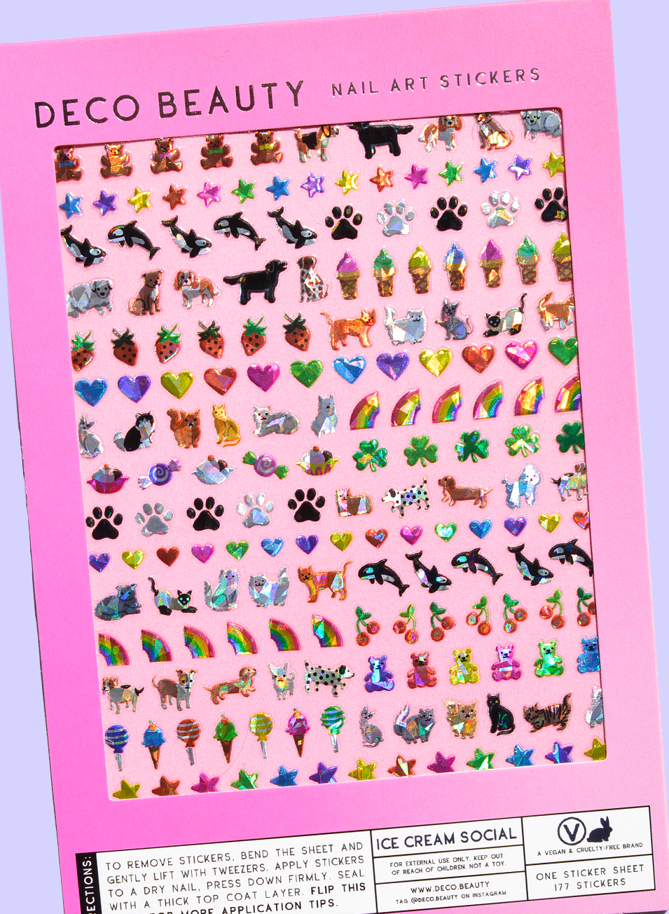 Sheet of nail art stickers with various designs on a pink background