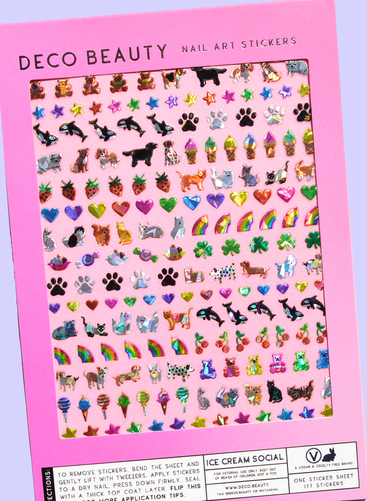 Sheet of nail art stickers with various designs on a pink background