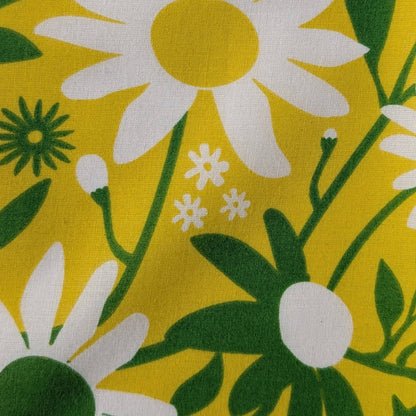Floral pattern with white flowers and green leaves on a yellow background