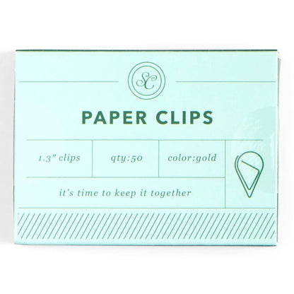 Packaging of gold paper clips with text on a white background
