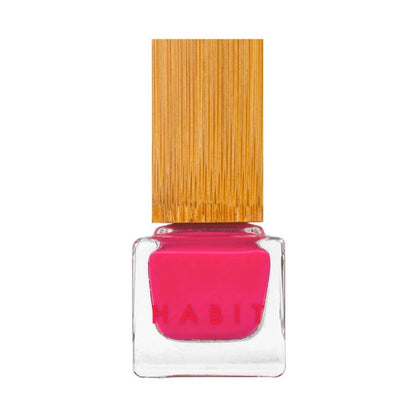 Pink nail polish bottle with a wooden cap on a white background