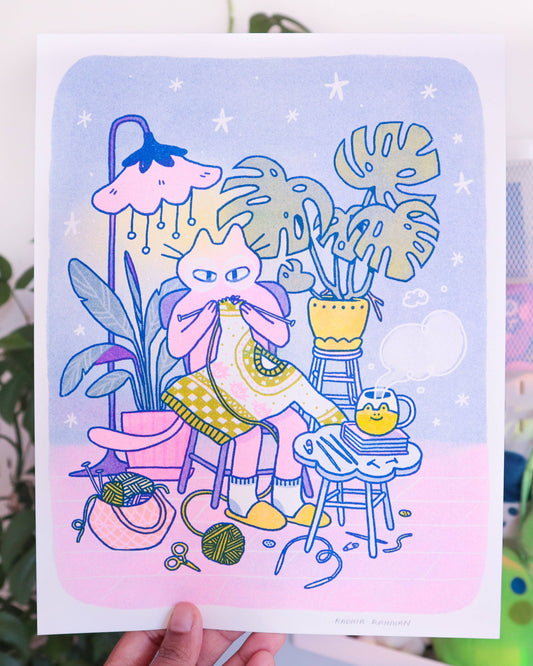 Knitting Kuni Riso Art Print, Illustration of a cat sitting with plants and yarn on a pastel background