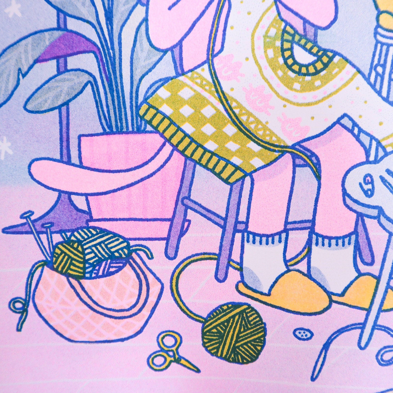 Knitting Kuni Riso Art Print Illustration of a cozy room with a chair, plant, and knitting supplies on a pink background