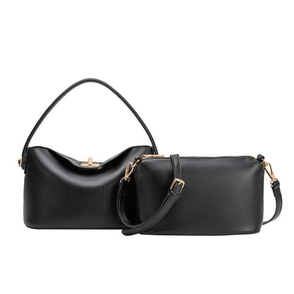 Black handbag with gold accents on a white background, Lana Black Crossbody Bag Melie Bianco