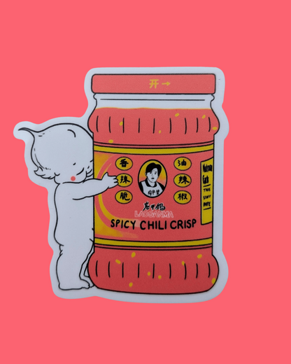 Illustration of a kewpie hugging a jar of 'Spicy Chilli Crisp' on a pink. background, Lao Gan Ma + Kewpie Vinyl Sticker