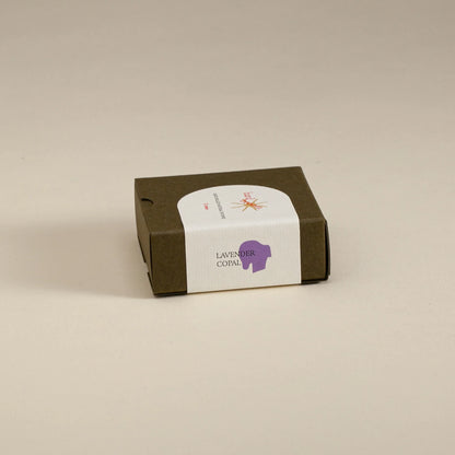 Small brown box with a white label on a beige background