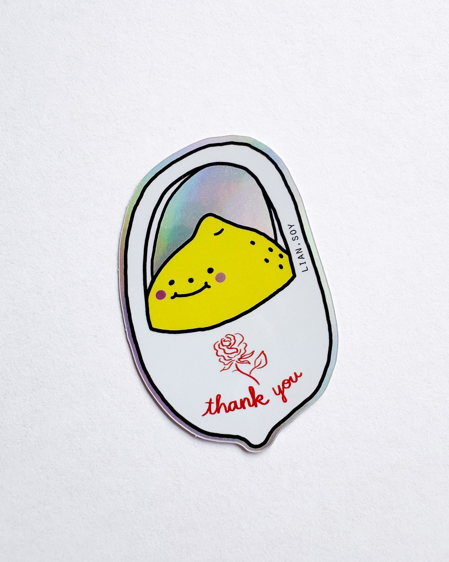 Sticker with a yellow character and 'thank you' text on a white background
