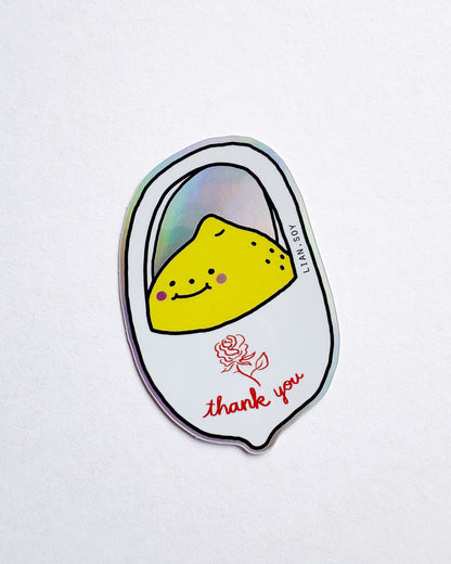 Sticker with a yellow character and 'thank you' text on a white background