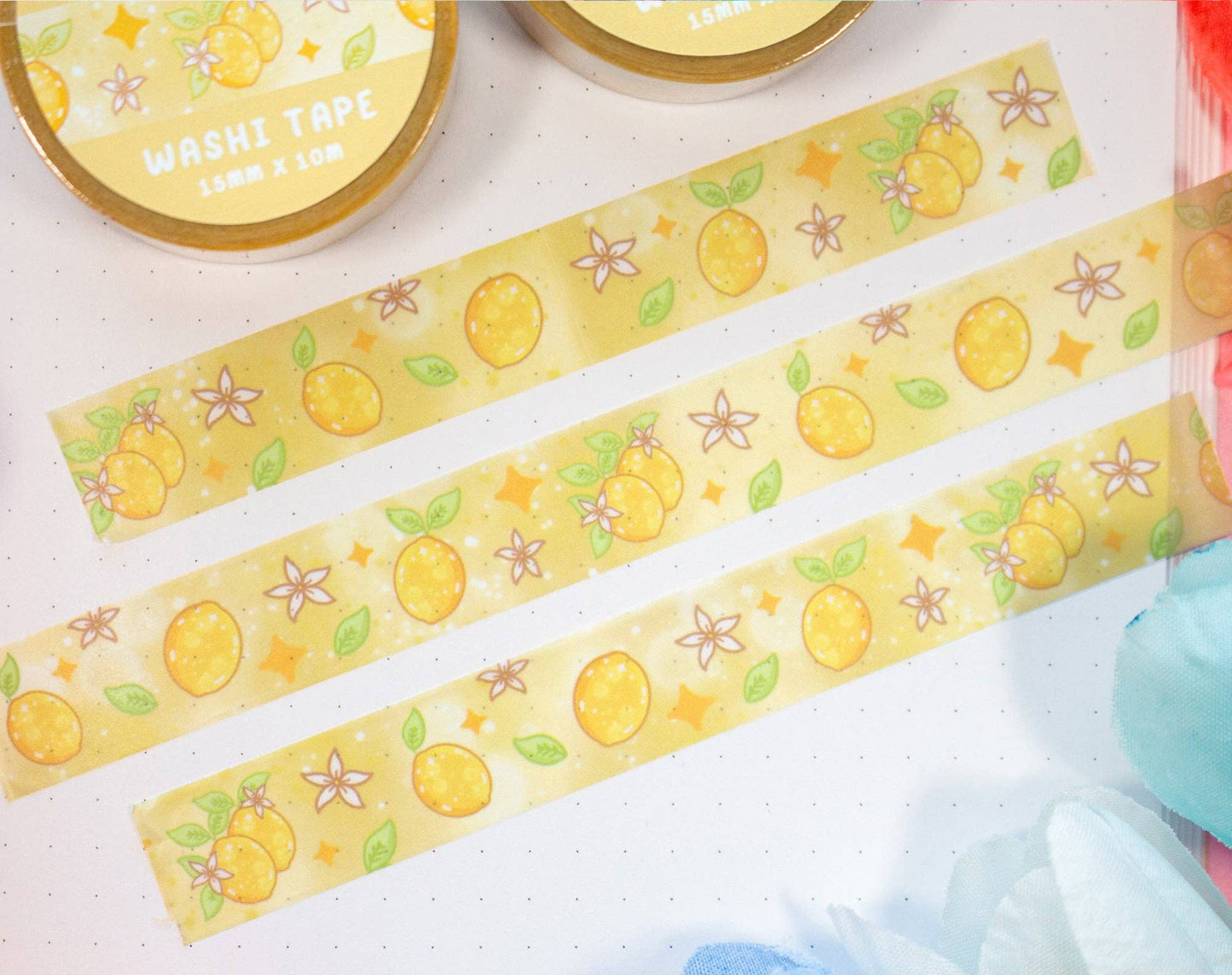 Decorative washi tape with lemon designs on a light surface