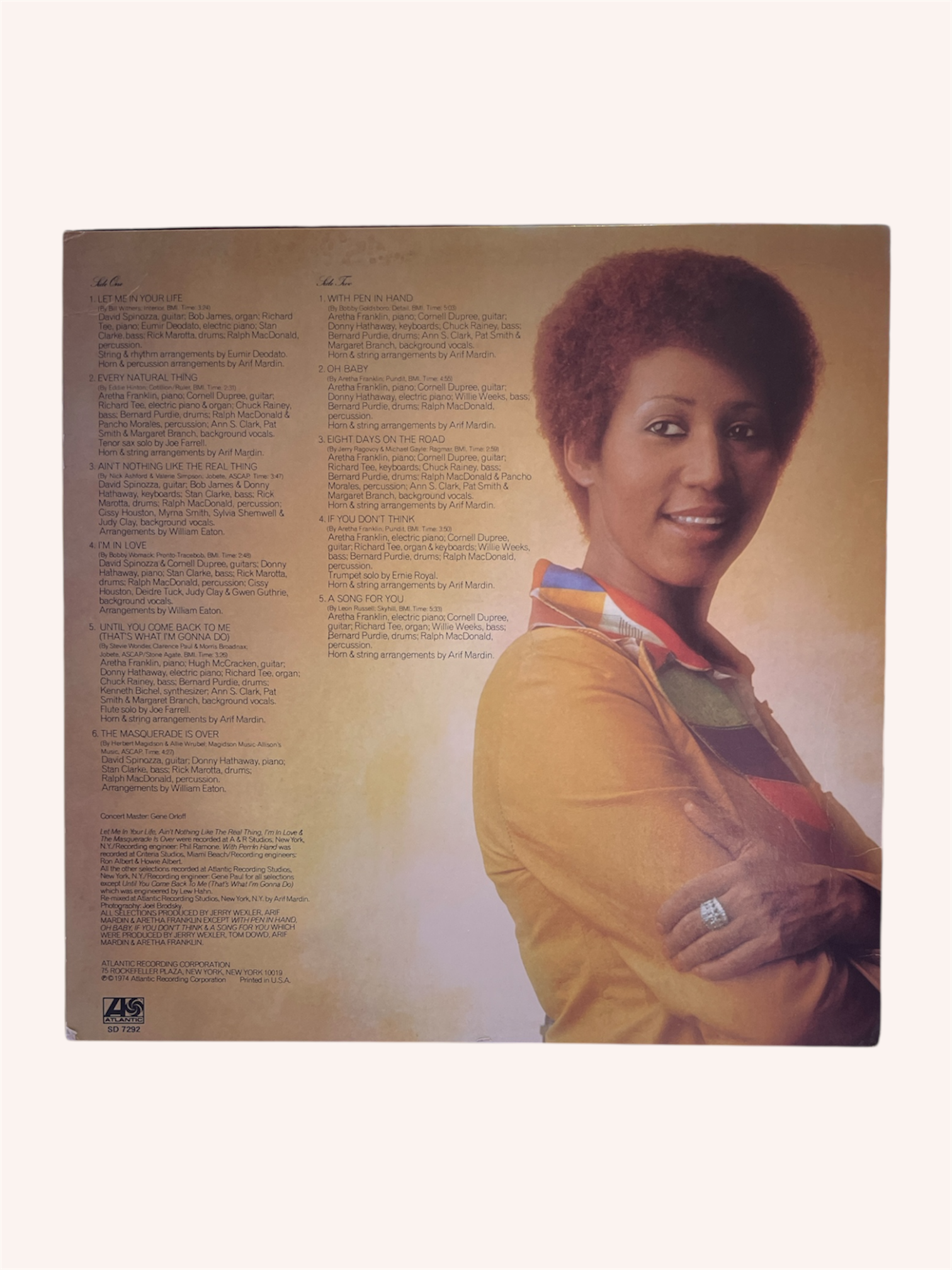 Album cover with a person on the back, featuring text and a portrait.