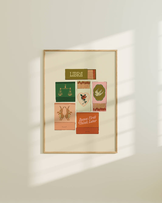 Framed artwork with colorful matchbox designs on a white wall