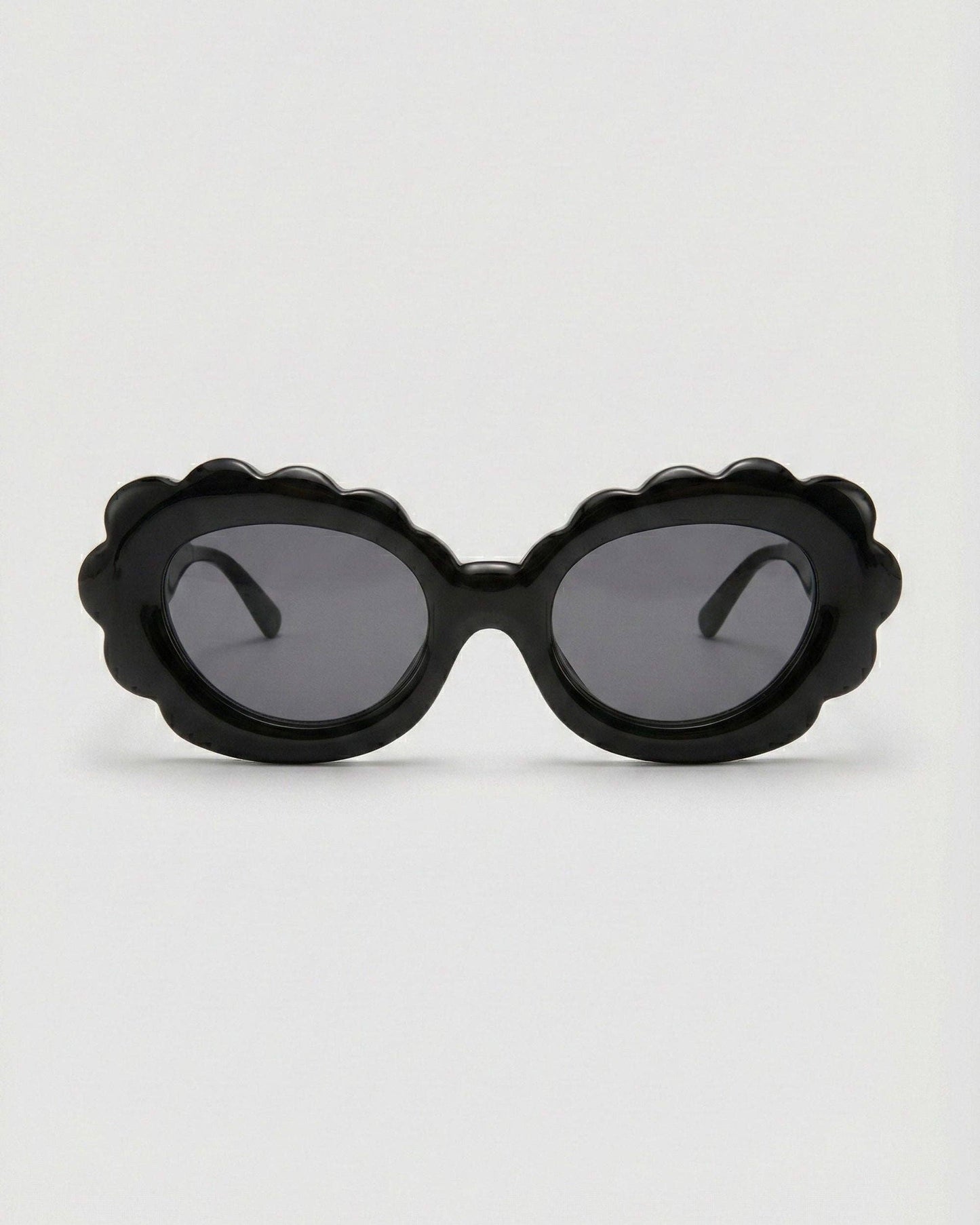 Black sunglasses with a unique frame design on a white background