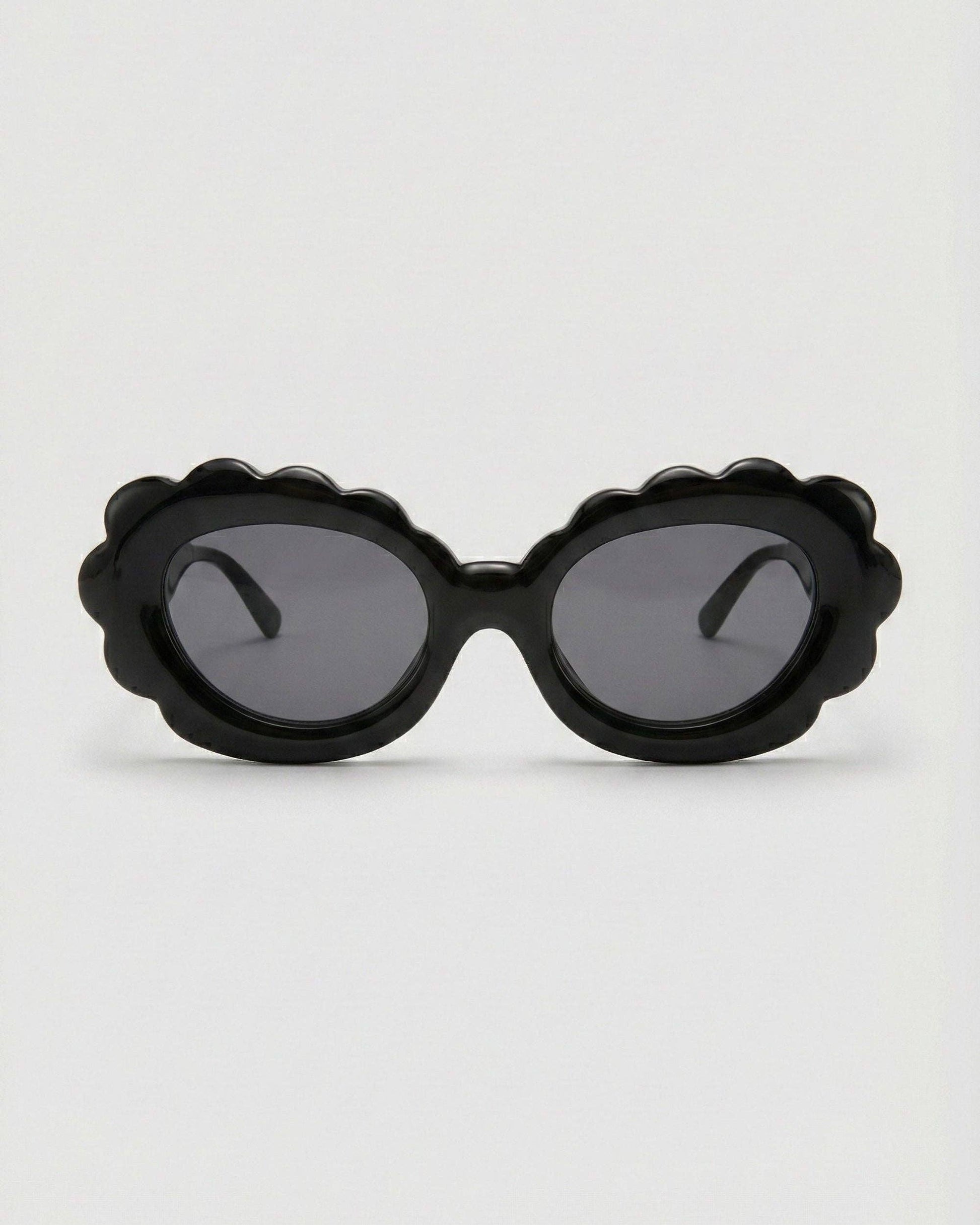 Black sunglasses with a unique frame design on a white background