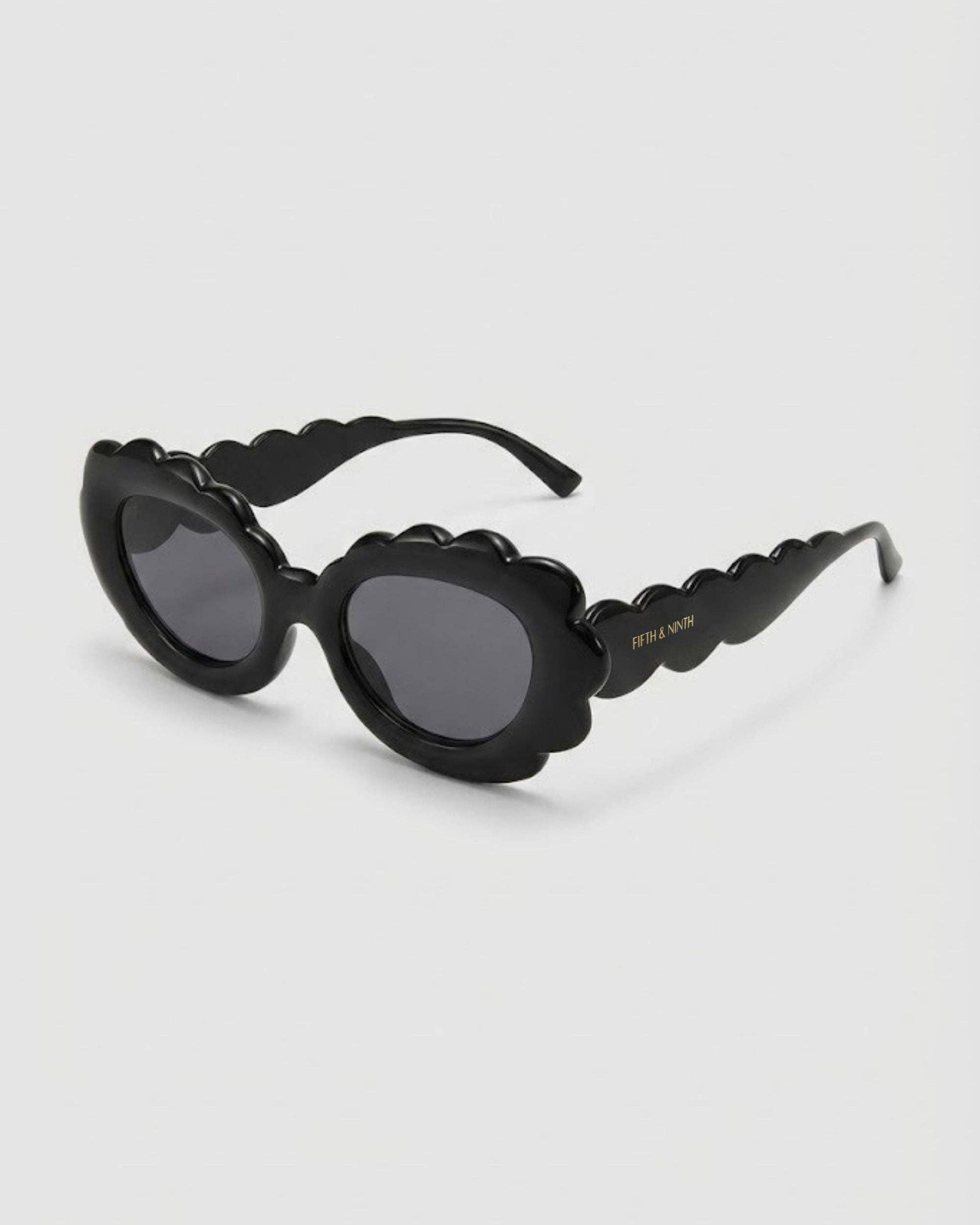 Black Prada sunglasses on a white background