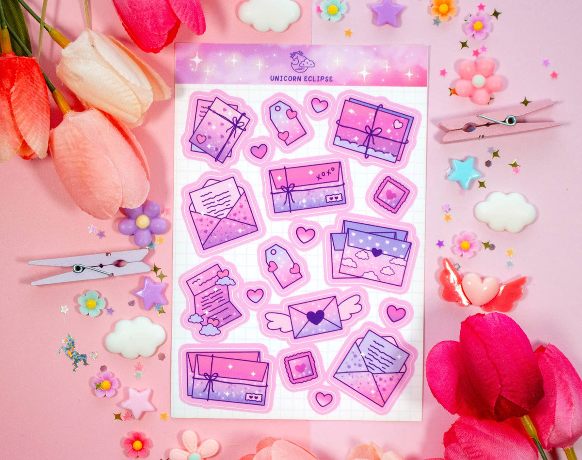 Sticker sheet with pink and purple designs on a pink background with flowers and scissors.