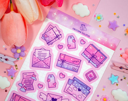 Sticker sheet with pink and purple designs on a pink background with flowers.