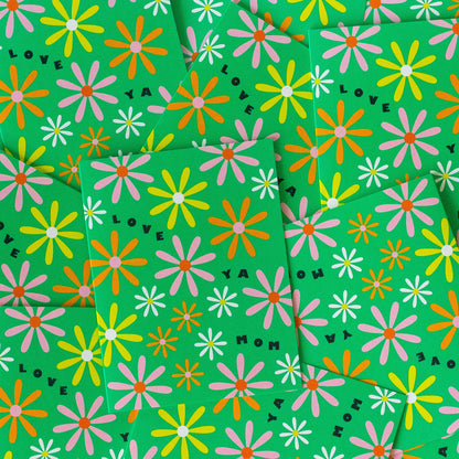 Green paper with colorful flower pattern and 'LOVE' text