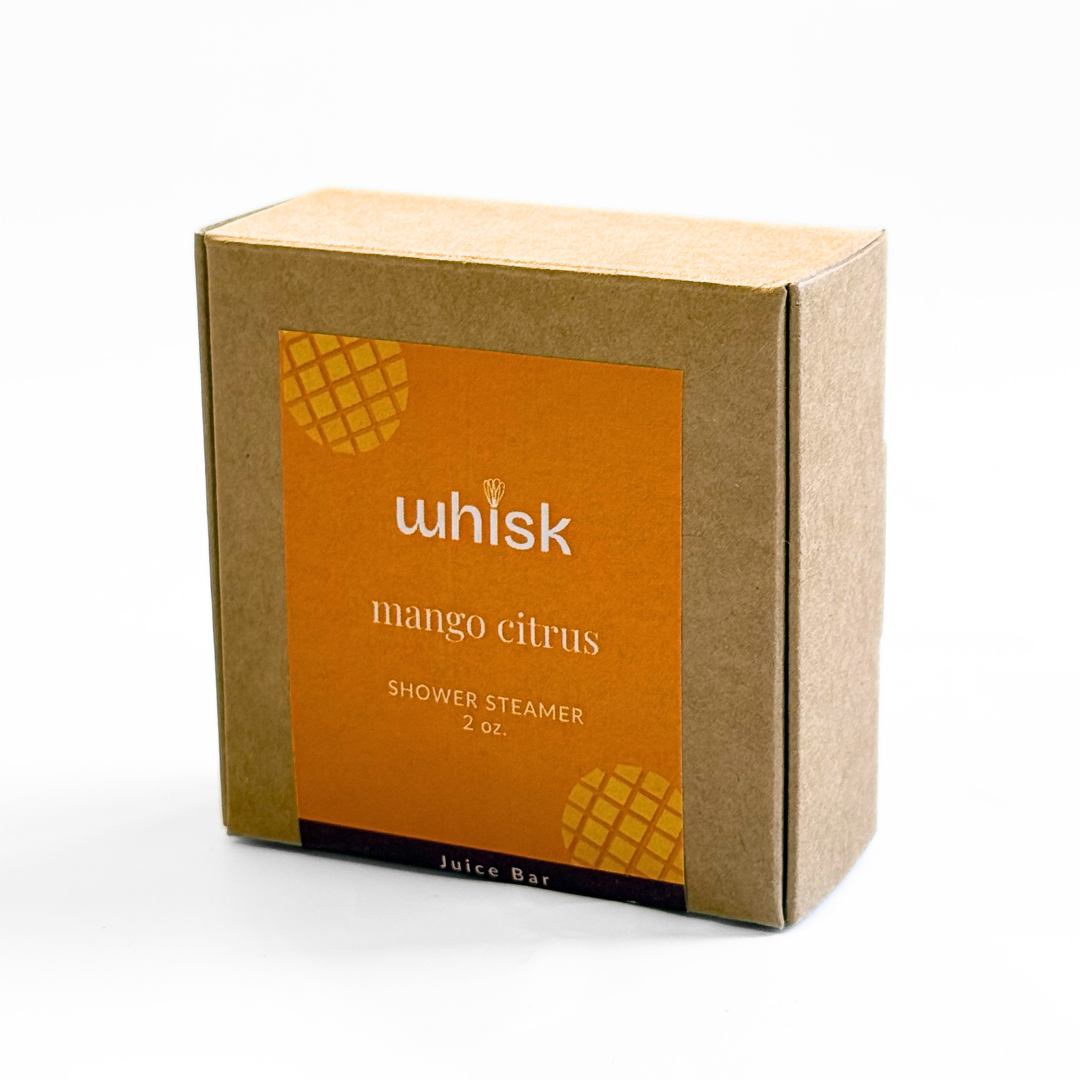 Whisk mango citrus shower steamer packaging on a white background