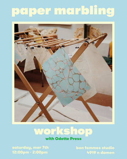 Advertisement for a paper marbling workshop with a sample piece of marbled paper on a stand.