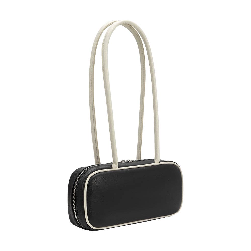 A black leather shoulder bag with a rounded rectangular silhouette, featuring a double strap in a light cream/off-white color and contrast cream piping along the edges.