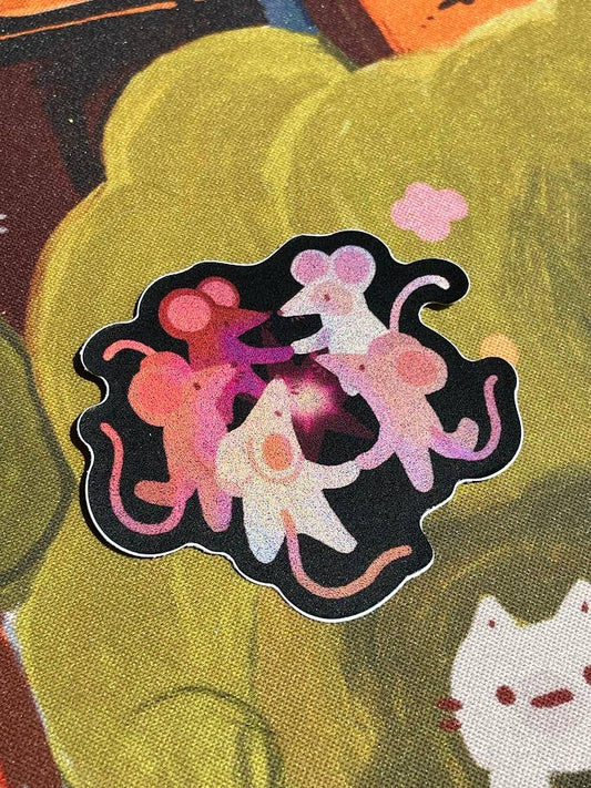 Colorful sticker of three cartoon mice on a textured background