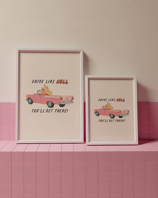 Two framed prints with a pink car illustration and text on a pink tiled wall.