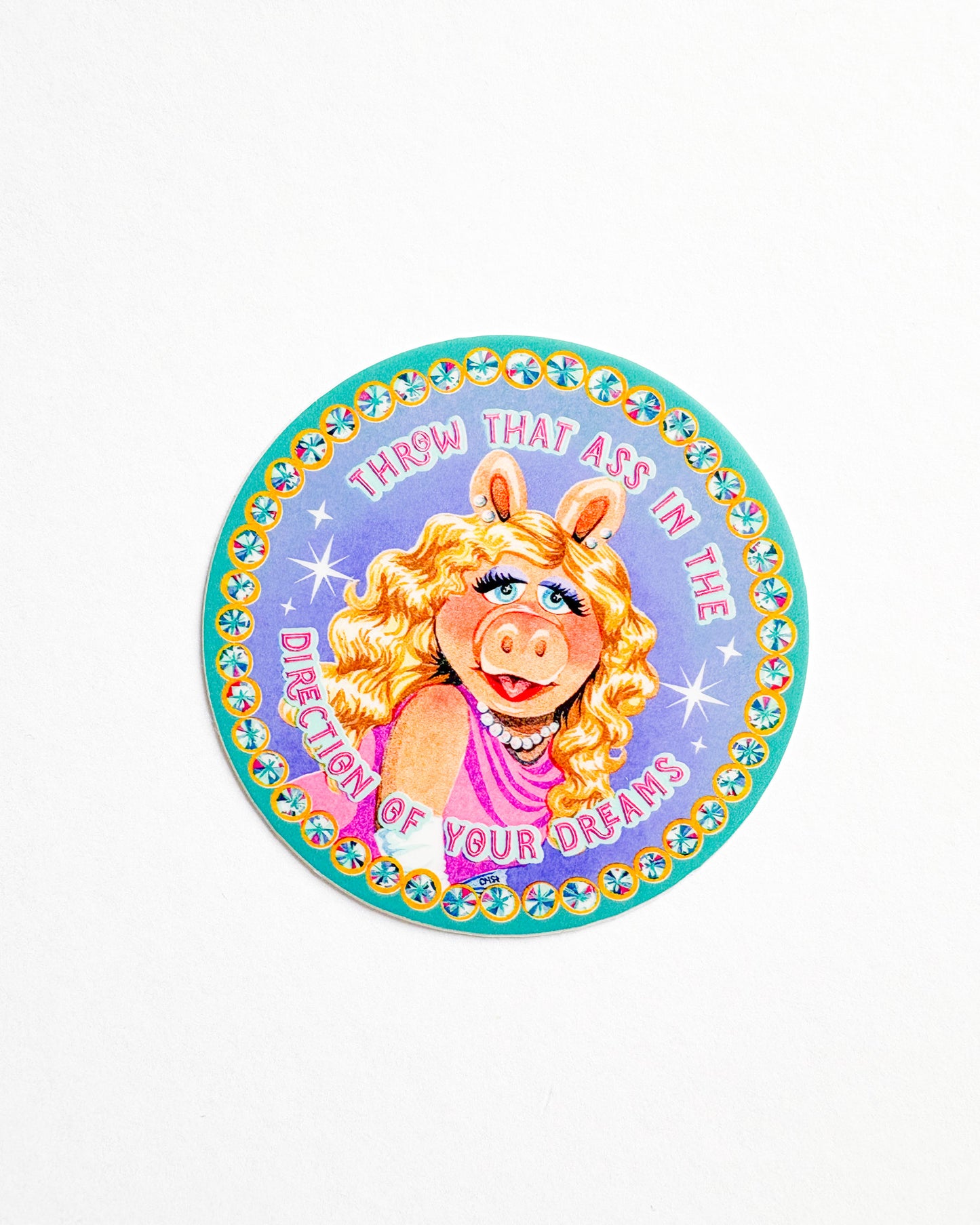 Circular sticker with a character design and text on a white background