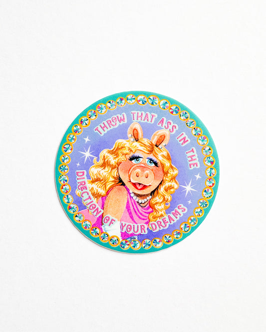 Circular sticker with a character design and text on a white background
