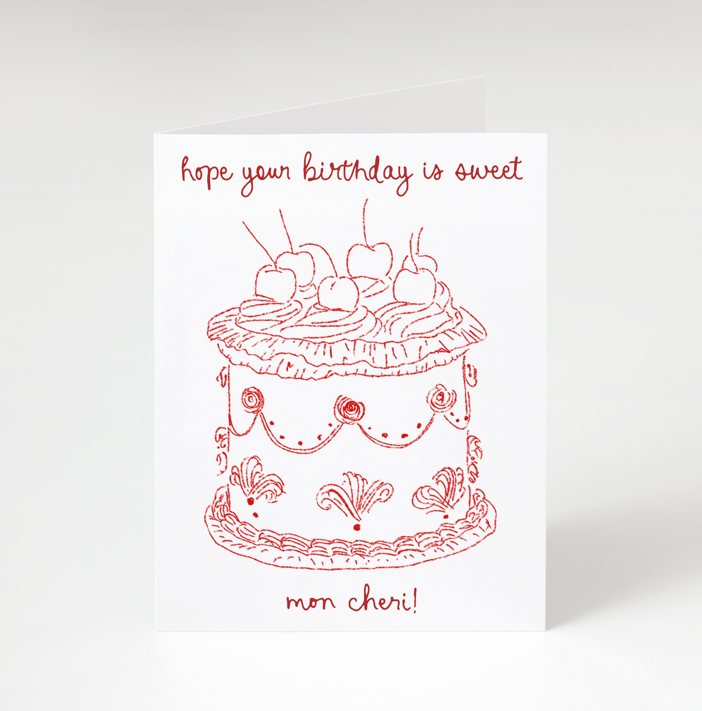 Greeting card with red cake illustration and text on a white background