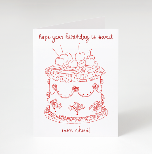 Greeting card with red cake illustration and text on a white background