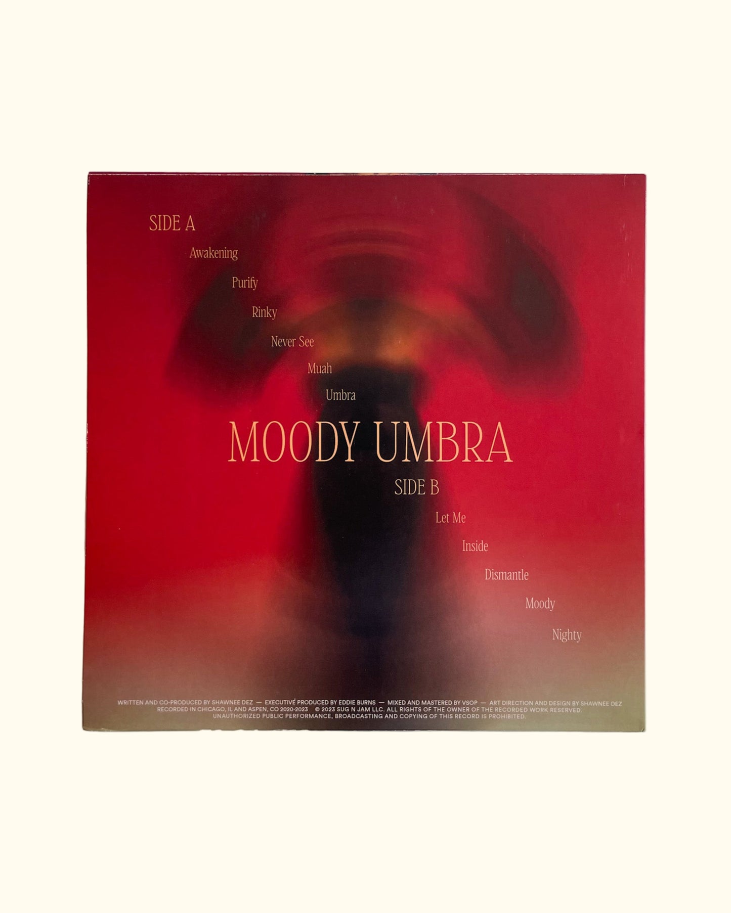Vinyl record cover with 'Moody Umbra' text on a red background