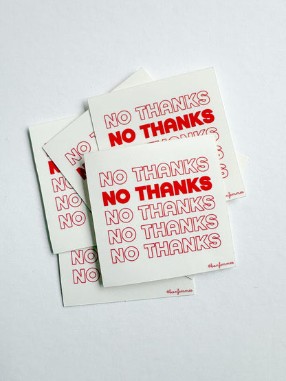 Three 'No Thanks' stickers with red text on a white background