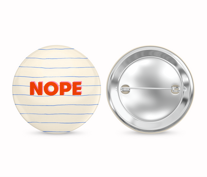 Button badge with 'NOPE' text on a striped background