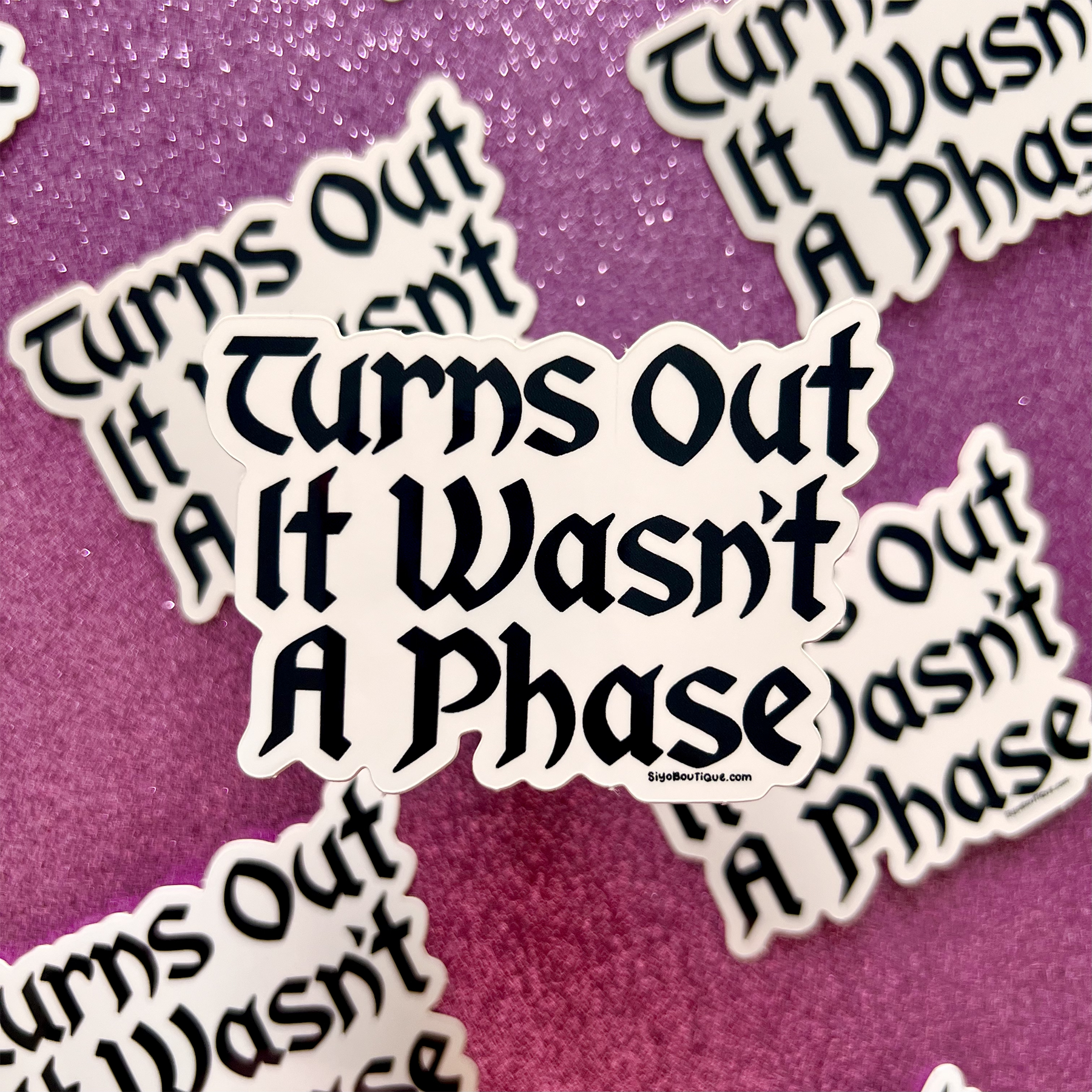 Stickers with text 'Turns Out It Wasn't A Phase' on a purple background