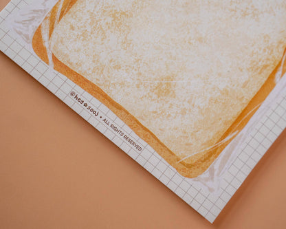 Printed paper with bread design on a grid background