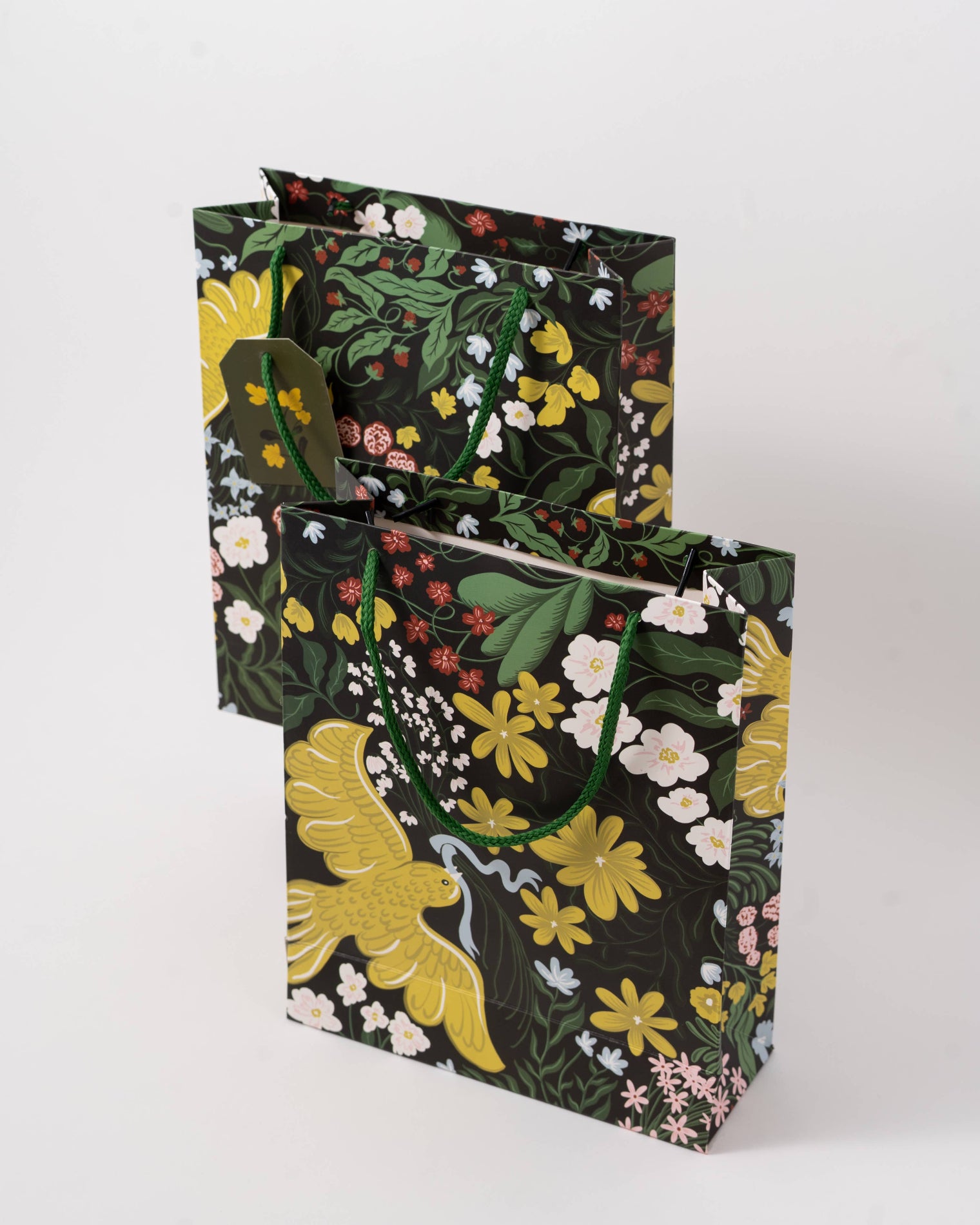 Floral-patterned gift bags on a white background