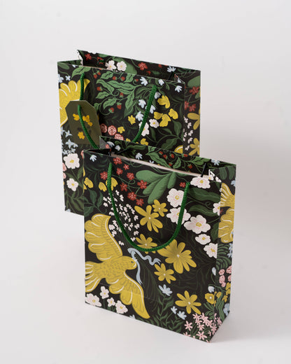 Floral-patterned gift bags on a white background