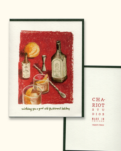 Greeting card with illustration of bottles and glasses on a red background, featuring the brand 'Chariot Studios'.