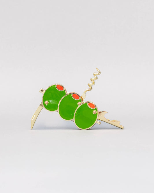 Green and gold insect-shaped wine opener on a light gray background