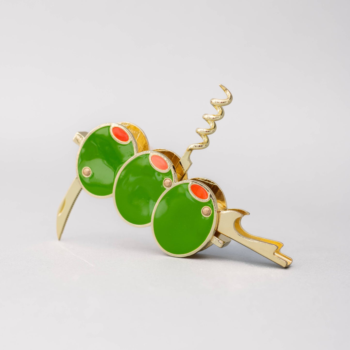 Green and gold o0live corckscrew on a light gray background