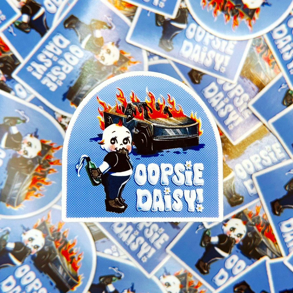 Stickers with 'Oopsie Daisy' character and text on a blue background