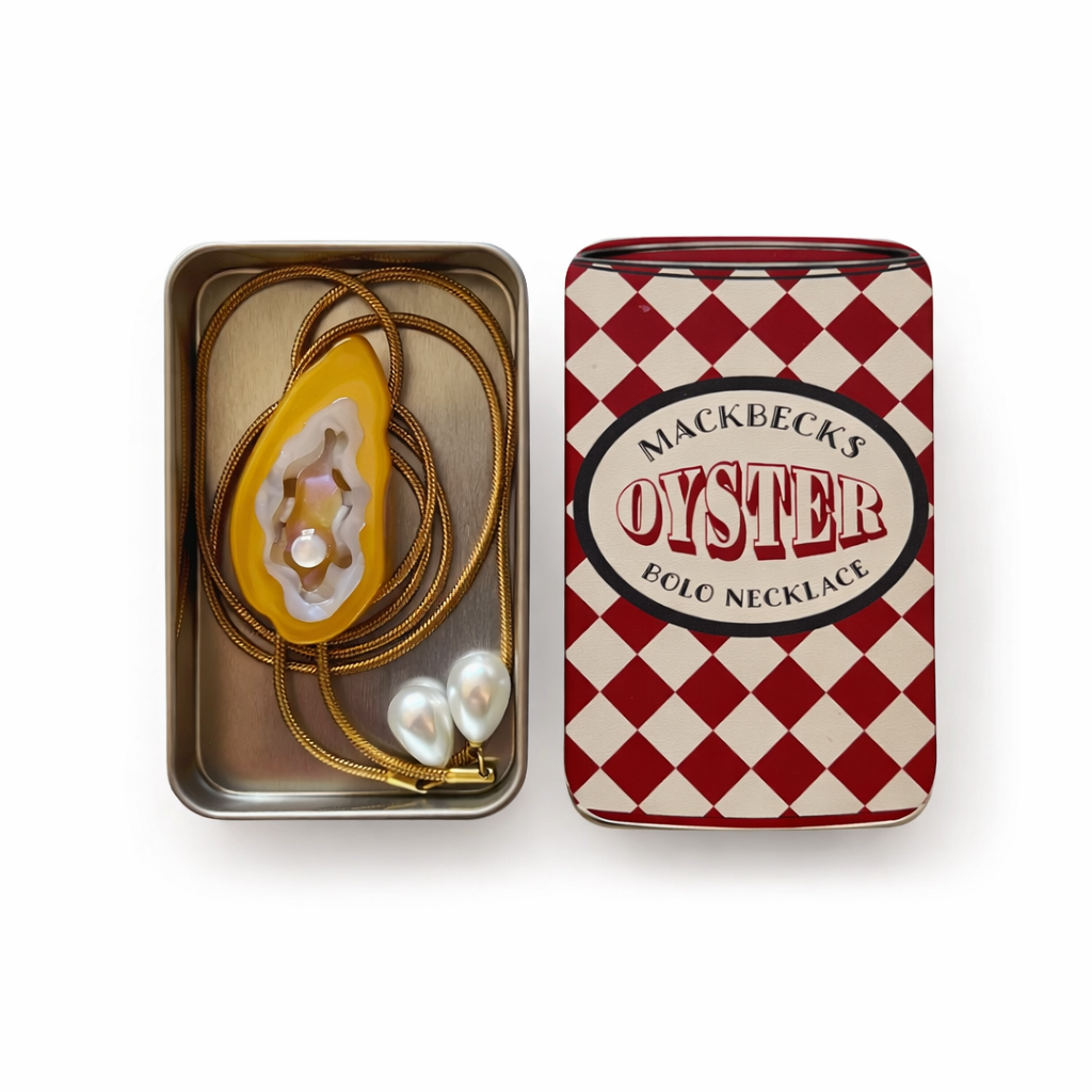 Mackbecks Oyster Polo Necklace in a checkered tin box