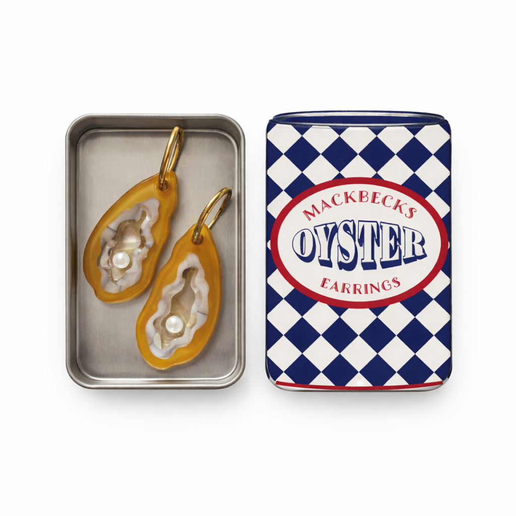 Oyster-shaped earrings in a Mackbecks branded tin on a white background