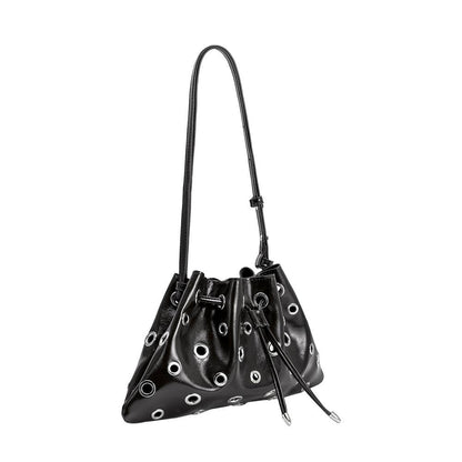Black handbag with eyelet details on a white background